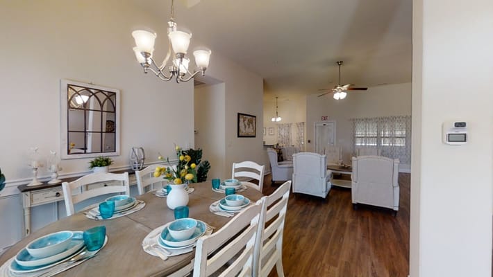 Dining area with table set for a meal