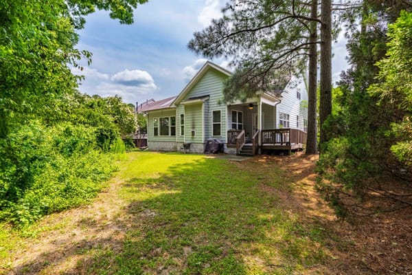 Exterior view of a senior living facility surrounded by greenery