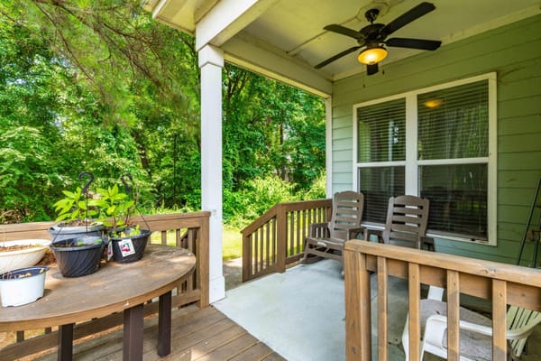 Outdoor seating area with plants and greenery