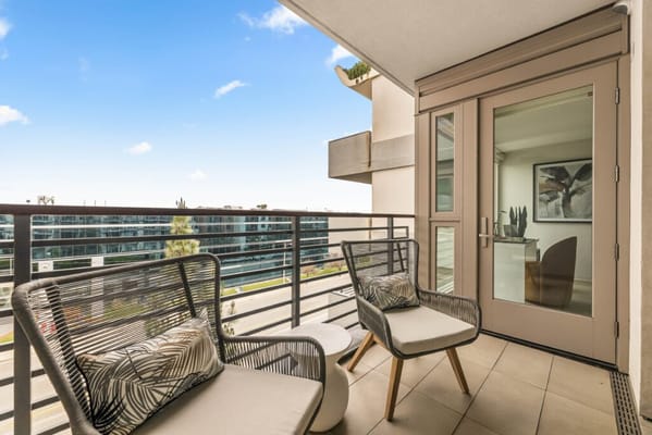Outdoor balcony with chairs and view