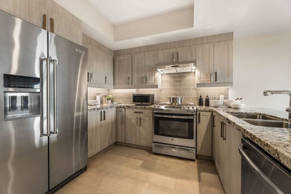 Contemporary kitchen with stainless steel appliances and granite countertops