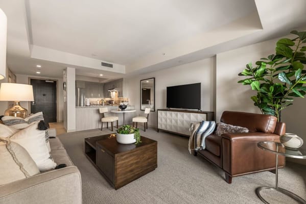 Modern living room with kitchen area in senior facility