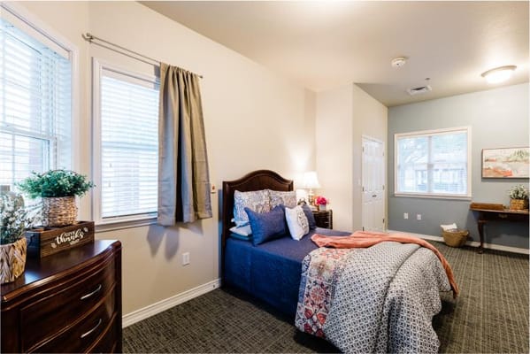Cozy resident room with bed and decor