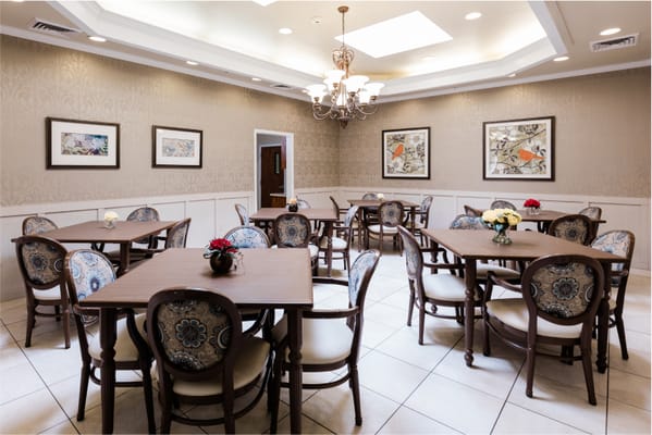 Bright dining room with decorative tables and chairs
