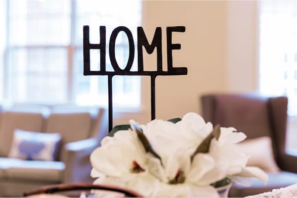 Decorative 'HOME' sign in a common area