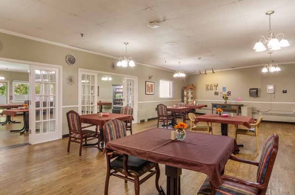 Dining area with tables and chairs at Creekside Village Health and Rehabilitation Center
