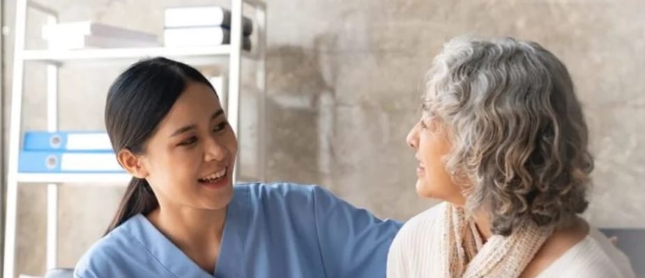 Caregiver interacting with a senior resident
