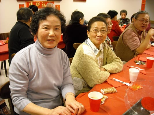 Residents enjoying a meal at a communal table