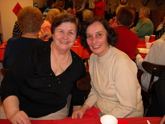 Two residents smiling at a social gathering