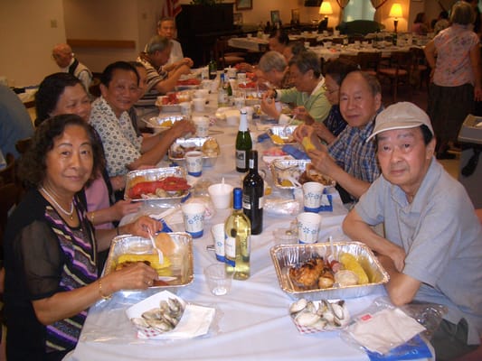 Residents enjoying a meal together in a communal dining area