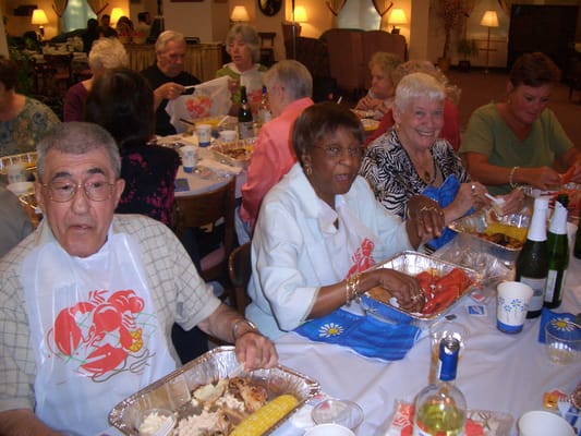 Residents enjoying a festive meal together in a dining area