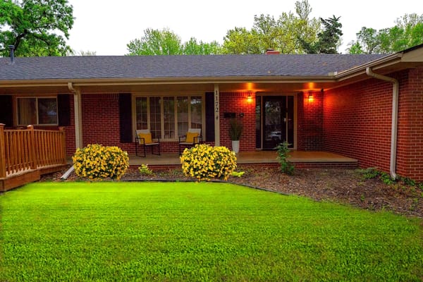 Exterior view of a welcoming entrance with garden