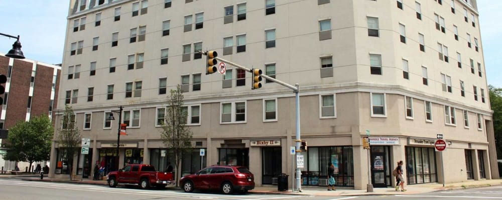 Facade of Bixby Brockton with people walking by