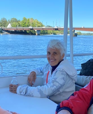 A smiling resident enjoying a boat ride