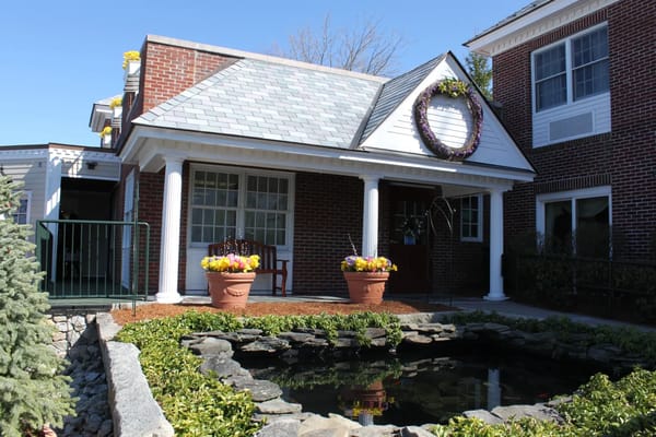 Exterior view of a welcoming assisted living entrance