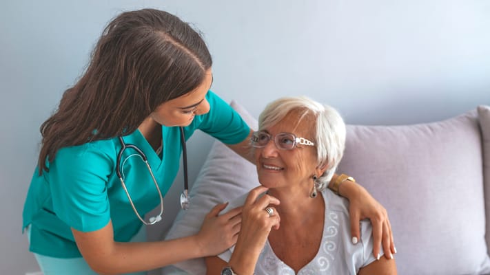 Caregiver interacting with a senior resident