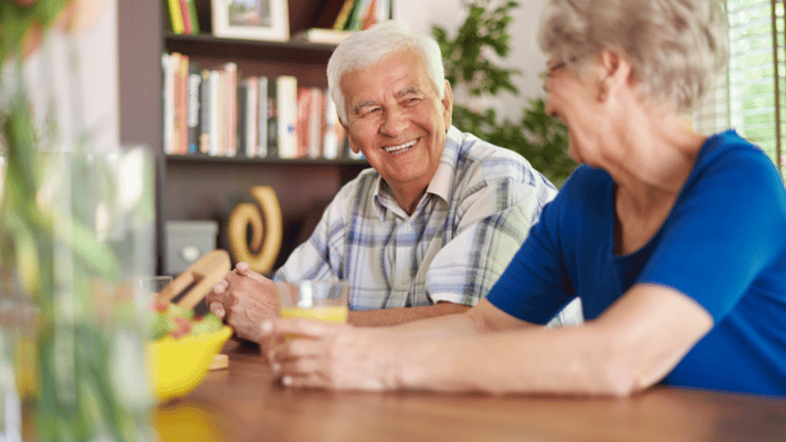 Seniors enjoying a pleasant conversation over drinks
