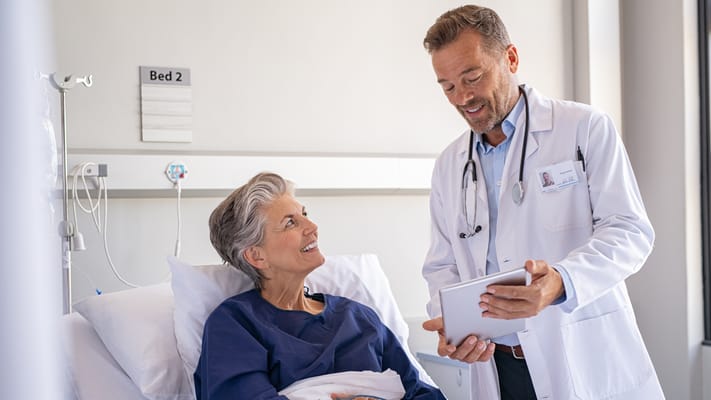 Doctor talking to a patient in a hospital room