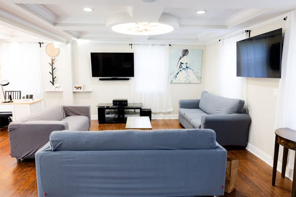 Bright common area with sofas and artwork