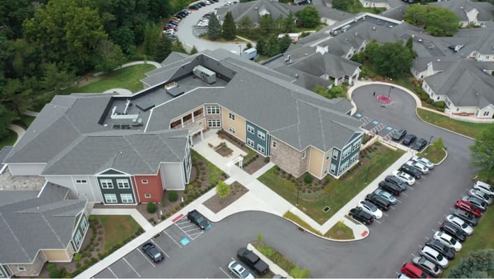 Aerial view of the senior living facility campus with parking.