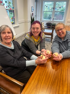 Residents and staff engaging in a fun activity indoors