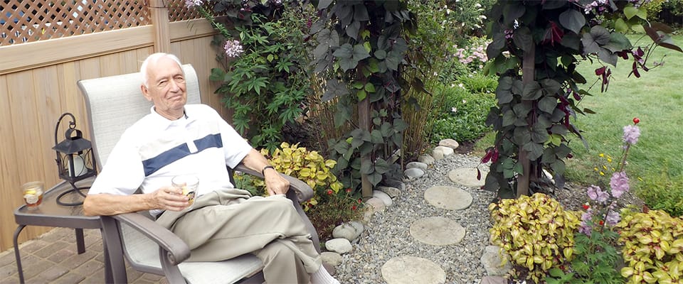 Senior resident enjoying a garden space