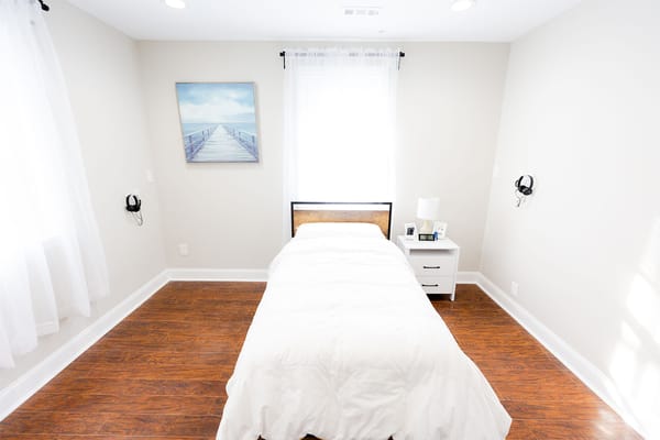 Bright, clean private bedroom with a single bed