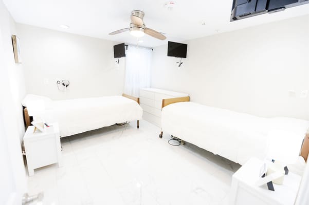 Private resident room with two beds and modern decor