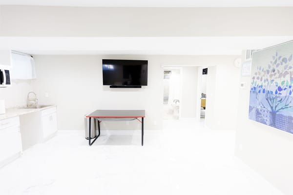 Bright interior room with a TV and table