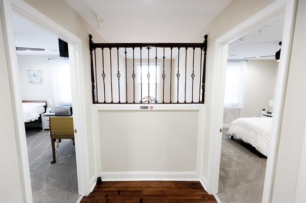 Hallway view of resident rooms with doors