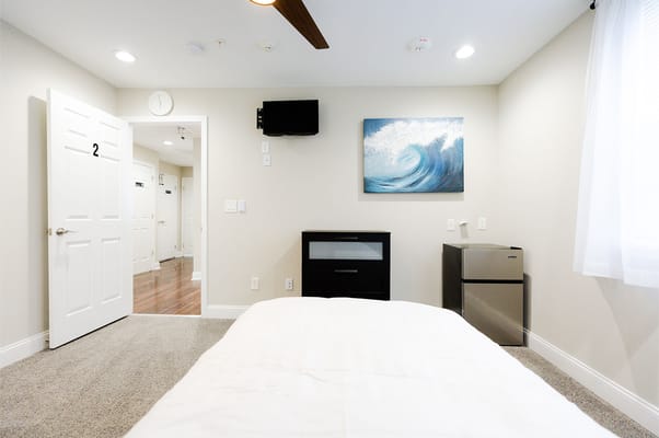 Cozy resident room with a bed and wall art