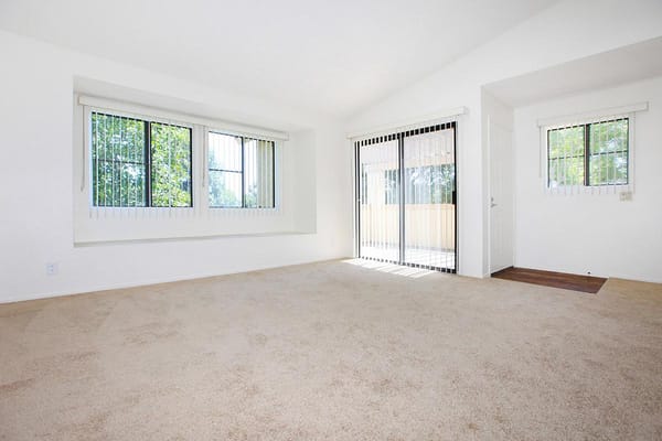 Living room with large windows and sliding glass door