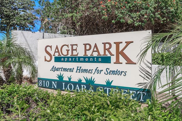 Sign for Sage Park Senior Apartments with address