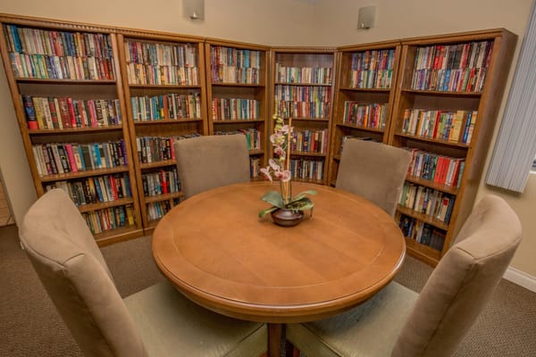 Cozy reading room with bookshelves and a table