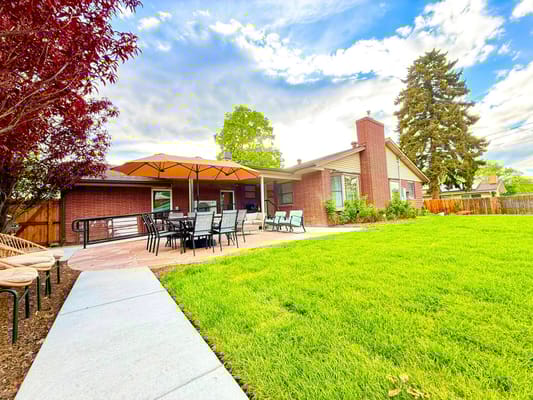 Outdoor patio area with seating and umbrellas