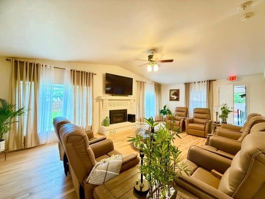 Bright common area with comfortable seating and large windows