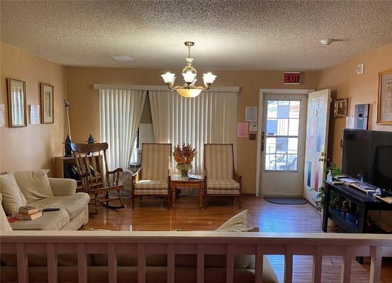 Bright and inviting living room with comfortable seating and natural light.