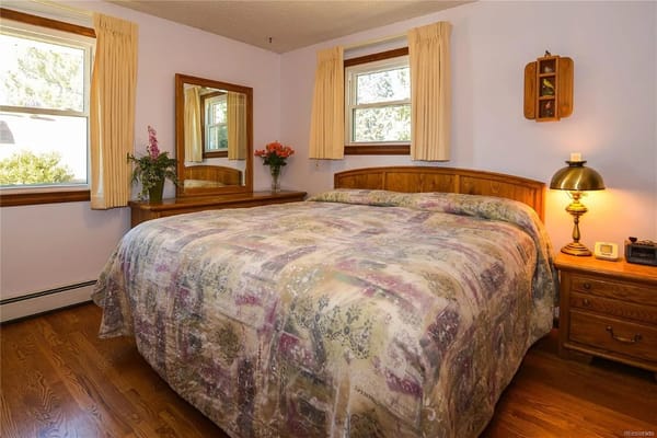 Cozy bedroom with a large bed and wooden furniture