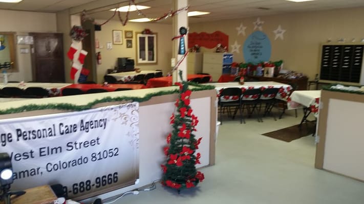 Holiday-decorated common area with tables and chairs