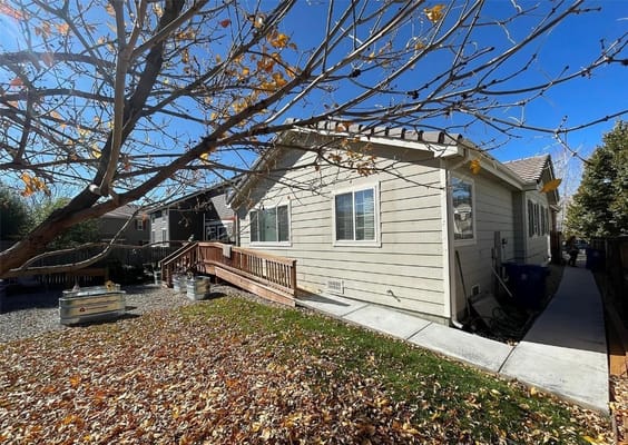 Side view of the Wellspring Brighton building surrounded by fall leaves.