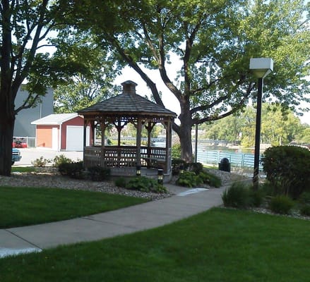 Wooden gazebo surrounded by greenery at Vannoni Living Center
