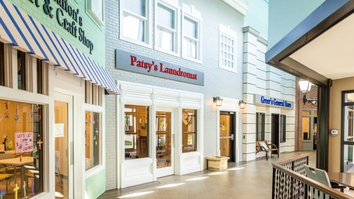 Interior view of a community space with shops