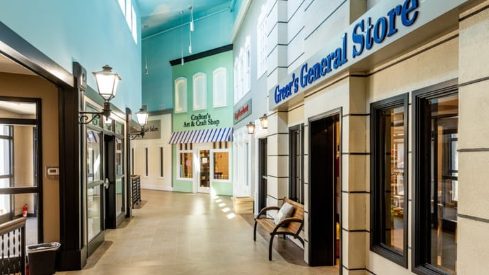 Interior hallway with storefronts in a senior facility