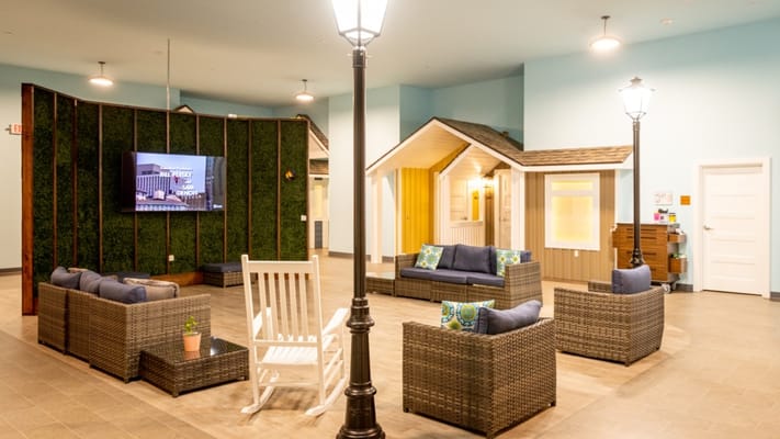 Common area with seating and decorative houses