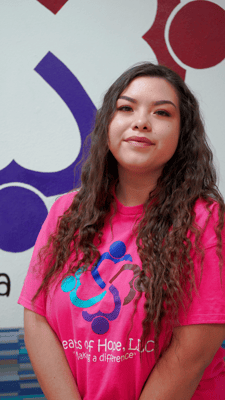 Staff member posing in a facility interior