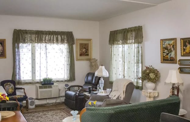 Cozy common area with seating and windows