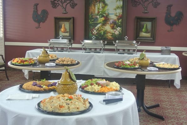 A dining area with a variety of food displayed on tables