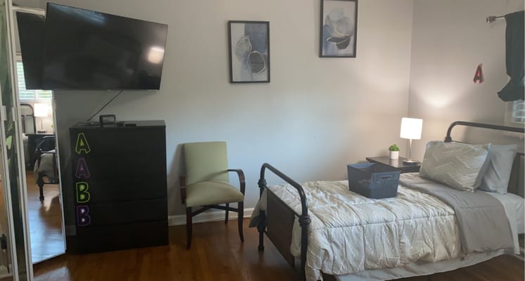 Interior view of a resident room with furniture
