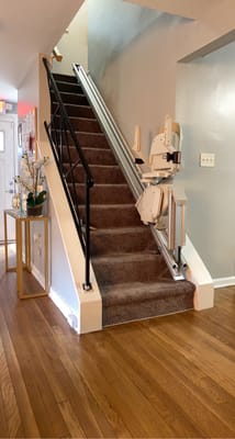 Stair lift installed in a facility hallway