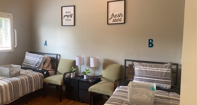 Cozy shared resident room with two beds and decor